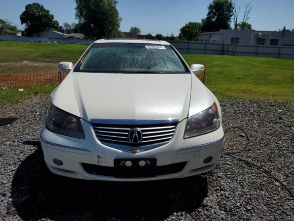 2006 Acura RL z VIN JH4KB16576C012132, wystawiony jako Copart lot #61897805 z przebiegiem 143 101 mil mil oraz Szkoda całkowita • Salvage title. Historia ofert i sprzedaży dostępna na DreamBid. Obrazek 5.