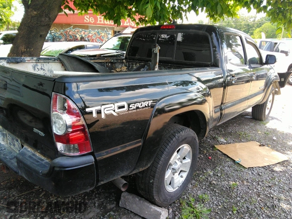 2014 Toyota Tacoma with VIN 3TMMU4FN6EM072471, listed as a IAAI auction lot 42525218 with 150,461 mi miles and . Bid and sale history available at DreamBid. Image 4.