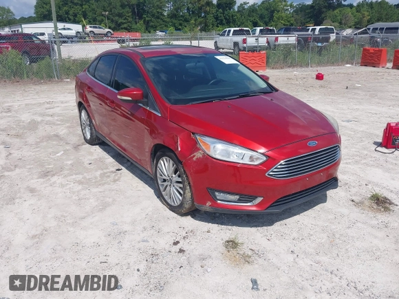 2018 Ford Focus Titanium z VIN 1FADP3J23JL295888, wystawiony jako IAAI lot #42524088 z przebiegiem 108 812 mil mil oraz . Historia ofert i sprzedaży dostępna na DreamBid. Obrazek 1.