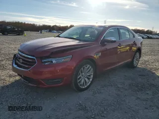2014 Ford Taurus Limited with VIN 1FAHP2F81EG183128, listed as a Copart auction lot 82409384 with 107,624 mi miles and Salvage title. Bid and sale history available at DreamBid. Image 1.