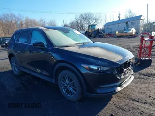2021 Mazda CX-5 Touring with VIN JM3KFBCM2M1303063, listed as a IAAI auction lot 41814604 with 36,116 mi miles. Bid and sale history available at carsss.com. Image 1.