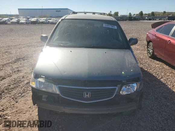 1999 Honda Odyssey EX with VIN 2HKRL1860XH541737, listed as a Copart auction lot 88897965 with 112,164 mi miles and Salvage title. Bid and sale history available at DreamBid. Image 5.