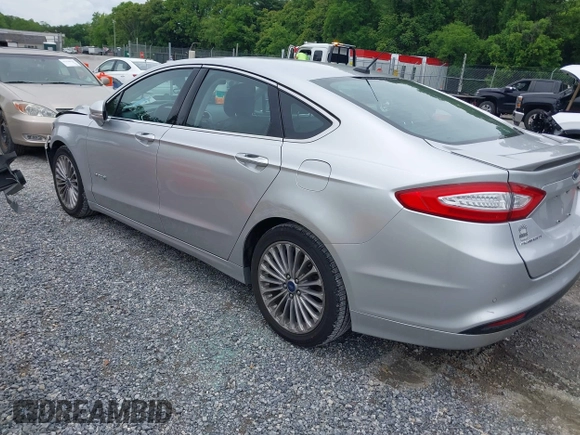 2013 Ford Fusion Titanium Hybrid with VIN 3FA6P0RU3DR281914, listed as a IAAI auction lot 42380838 with 166,956 mi miles and . Bid and sale history available at DreamBid. Image 3.