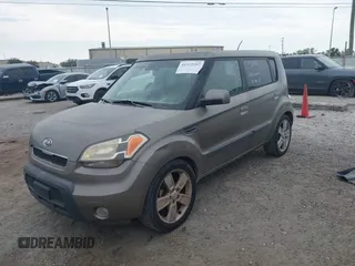 2010 Kia Soul + with VIN KNDJT2A22A7045182, listed as a IAAI auction lot 41322297 with 178,817 mi miles. Bid and sale history available at carsss.com. Image 2.