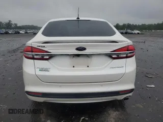 2017 Ford Fusion Titanium z VIN 3FA6P0SUXHR268559, wystawiony jako Copart lot #57456085 z przebiegiem 124 072 mil mil oraz Szkoda całkowita • Salvage title. Historia ofert i sprzedaży dostępna na DreamBid. Obrazek 6.