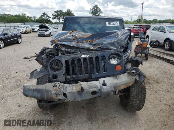 2012 Jeep Wrangler Unlimited Sport z VIN 1C4BJWDG4CL243538, wystawiony jako Copart lot #58826675 z przebiegiem 126 646 mil mil oraz Szkoda całkowita • Salvage title. Historia ofert i sprzedaży dostępna na DreamBid. Obrazek 5.