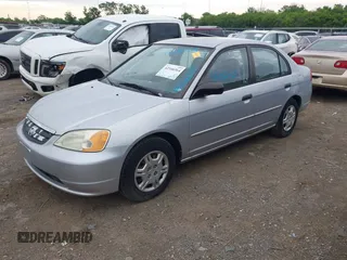 2001 Honda Civic LX with VIN 1HGES16541L049356, listed as a IAAI auction lot 42166564 with 207,913 mi miles. Bid and sale history available at carsss.com. Image 2.