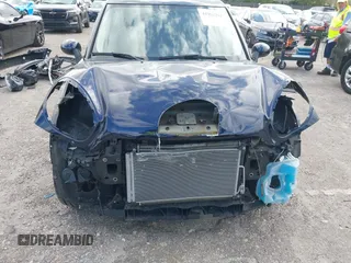 2013 MINI Countryman with VIN WMWZB3C58DWM07817, listed as a IAAI auction lot 41962291 with 60,763 mi miles and . Bid and sale history available at DreamBid. Image 6.
