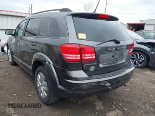 2017 Dodge Journey SE with VIN 3C4PDCAB9HT603595, listed as a IAAI auction lot 41914690 with 104,960 mi miles and . Bid and sale history available at DreamBid. Image 6.