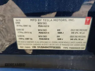 2015 Tesla Model S 85D with VIN 5YJSA4H47FF083005, listed as a IAAI auction lot 40970624 with 84,327 mi miles. Bid and sale history available at carsss.com. Image 9.