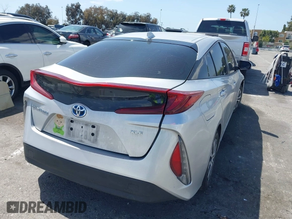 2021 Toyota Prius LE with VIN JTDKAMFP1M3180370, listed as a IAAI auction lot 41928512 with 83,249 mi miles and . Bid and sale history available at DreamBid. Image 4.