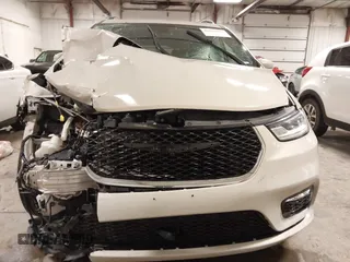 2021 Chrysler Pacifica Touring L with VIN 2C4RC1BG7MR531772, listed as a IAAI auction lot 41834392 with 156,123 mi miles and . Bid and sale history available at DreamBid. Image 6.