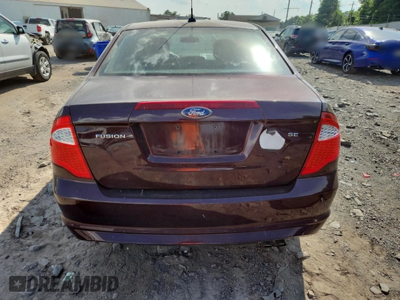 2012 Ford Fusion SE z VIN 3FAHP0HA7CR387524, wystawiony jako Copart lot #62083235 z przebiegiem 104 698 mil mil oraz Szkoda całkowita • Salvage title. Historia ofert i sprzedaży dostępna na DreamBid. Obrazek 6.