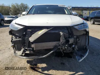 2020 Audi Q3 Premium with VIN WA1AECF30L1023652, listed as a Copart auction lot 57148915 with 69,621 mi miles and Salvage title. Bid and sale history available at DreamBid. Image 5.