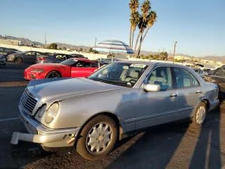 1999 Mercedes-Benz E-Class with VIN WDBJF65H8XA734585, listed as a Copart auction lot 79141194 with 196,908 mi miles and Salvage Title. Bid and sale history available at carsss.com. Image 1.