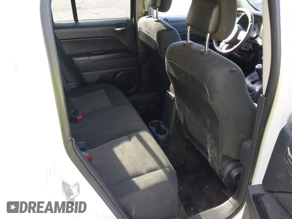 2014 Jeep Patriot Sport with VIN 1C4NJPBBXED671220, listed as a IAAI auction lot 42163245 with 216,848 mi miles. Bid and sale history available at carsss.com. Image 8.