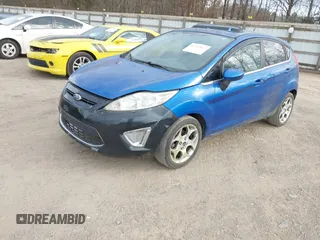 2011 Ford Fiesta SES with VIN 3FADP4FJ0BM113781, listed as a IAAI auction lot 41733662 with 191,092 mi miles. Bid and sale history available at carsss.com. Image 2.