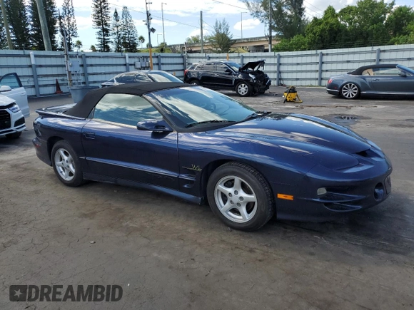 1999 Pontiac Firebird Trans Am with VIN 2G2FV32GXX2229175, listed as a Copart auction lot 65678225 with 180,298 mi miles and Salvage title. Bid and sale history available at DreamBid. Image 4.