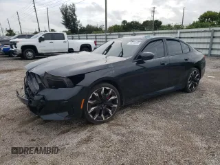 2024 BMW 5 Series 530i with VIN WBA43FJ00RCP78785, listed as a Copart auction lot 74415334 with 3,987 mi miles and Salvage Title. Bid and sale history available at carsss.com. Image 1.