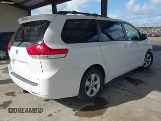 2014 Toyota Sienna LE AAS with VIN 5TDKK3DC4ES505293, listed as a IAAI auction lot 42021409 with 70,319 mi miles. Bid and sale history available at carsss.com. Image 4.