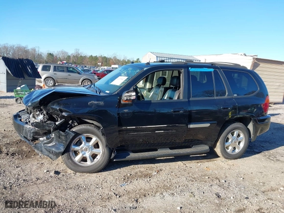 2005 GMC Envoy SLE with VIN 1GKDS13S152246568, listed as a IAAI auction lot 41293887 with 315,882 mi miles. Bid and sale history available at carsss.com. Image 14.