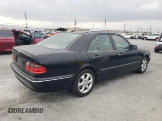 2002 Mercedes-Benz E-Class with VIN WDBJF65J42B486633, listed as a Copart auction lot 76979054 with 151,429 mi miles and Salvage Title. Bid and sale history available at carsss.com. Image 3.