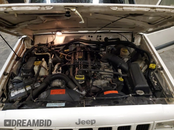 2000 Jeep Cherokee z VIN 1J4FF48S2YL104094, wystawiony jako Copart lot #57347705 z przebiegiem 75 948 mil mil oraz Nie do naprawy • Non repairable. Historia ofert i sprzedaży dostępna na DreamBid. Obrazek 11.
