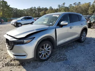 2021 Mazda CX-5 Grand Touring with VIN JM3KFADM8M1339008, listed as a Copart auction lot 49150115 with 144,851 mi miles and Salvage Title. Bid and sale history available at carsss.com. Image 1.