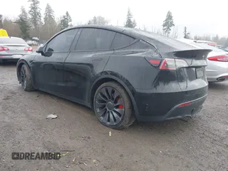 2021 Tesla Model Y Performance z VIN 5YJYGDEF2MF215938, wystawiony jako IAAI lot #41338287 z przebiegiem 63 925 mil mil oraz . Historia ofert i sprzedaży dostępna na DreamBid. Obrazek 3.