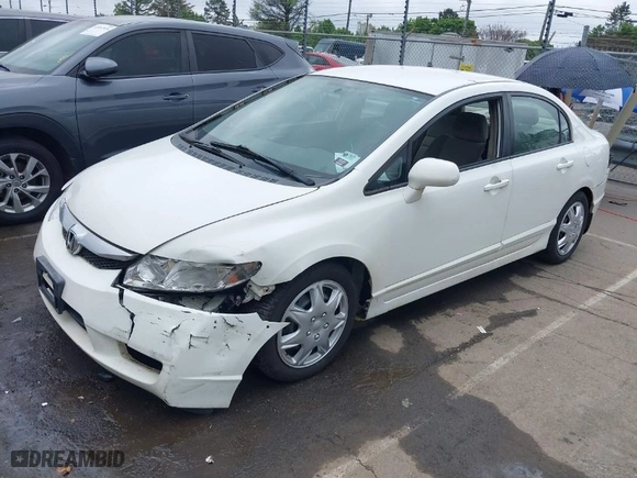 2010 Honda Civic Sdn LX with VIN 2HGFA1F58AH531042, listed as a IAAI auction lot 41933448 with 253,699 mi miles. Bid and sale history available at carsss.com. Image 2.