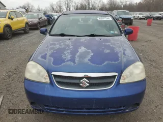 2006 Suzuki Forenza z VIN KL5JD56ZX6K372427, wystawiony jako Copart lot #80627544 z przebiegiem 94 493 mil mil oraz Tytuł czysty. Historia ofert i sprzedaży dostępna na DreamBid. Obrazek 5.