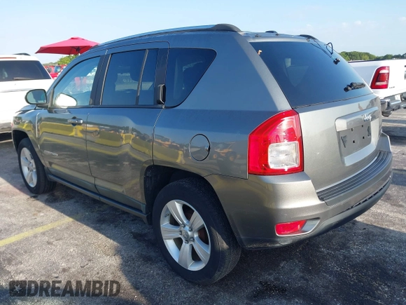 2011 Jeep Compass with VIN 1J4NT1FA4BD213994, listed as a IAAI auction lot 42020375 with 84,409 mi miles. Bid and sale history available at carsss.com. Image 3.