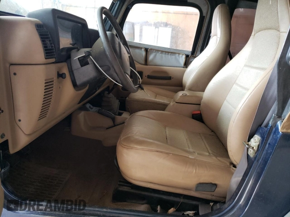 2000 Jeep Wrangler SE with VIN 1J4FA29P1YP739555, listed as a Copart auction lot 58501025 with 128,458 mi miles and Clean title. Bid and sale history available at DreamBid. Image 7.