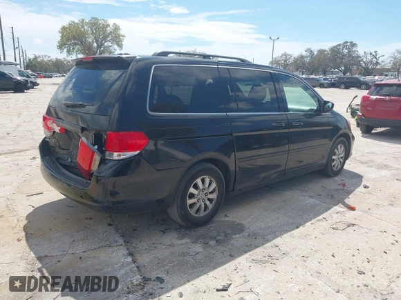 2010 Honda Odyssey EX-L with VIN 5FNRL3H79AB028724, listed as a IAAI auction lot 41687998 with 221,852 mi miles. Bid and sale history available at carsss.com. Image 4.