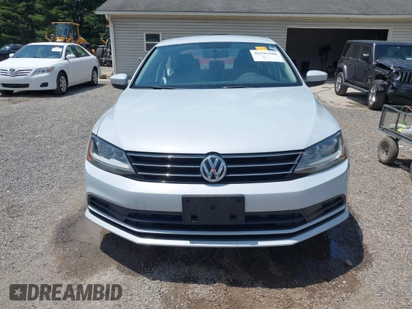2017 Volkswagen Jetta S z VIN 3VW2B7AJ8HM242804, wystawiony jako IAAI lot #42595566 z przebiegiem 96 551 mil mil oraz . Historia ofert i sprzedaży dostępna na DreamBid. Obrazek 13.