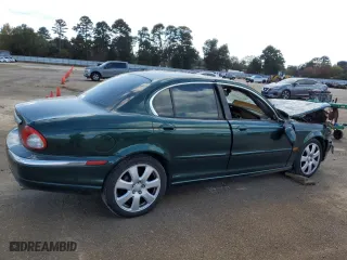 2004 Jaguar X-Type with VIN SAJEA51C34WE19153, listed as a Copart auction lot 77452474 with 0 mi miles and Salvage Title. Bid and sale history available at carsss.com. Image 3.