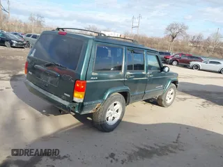 2000 Jeep Cherokee Classic with VIN 1J4FF58S6YL105920, listed as a IAAI auction lot 41497047 with 192,410 mi miles. Bid and sale history available at carsss.com. Image 4.