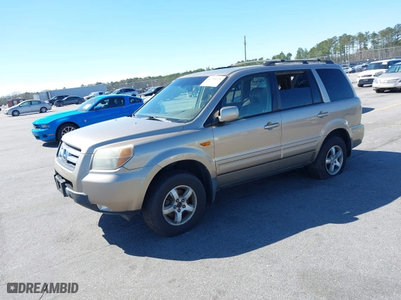 2006 Honda Pilot EX-L with VIN 5FNYF18516B020162, listed as a IAAI auction lot 41799229 with 304,627 mi miles. Bid and sale history available at carsss.com. Image 2.