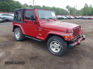 1999 Jeep Wrangler Sport z VIN 1J4FY19S0XP452636, wystawiony jako IAAI lot #42419034 z przebiegiem 289 150 mil mil oraz . Historia ofert i sprzedaży dostępna na DreamBid. Obrazek 1.