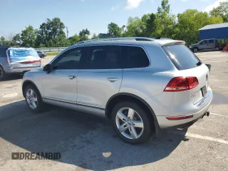 2014 Volkswagen Touareg Lux with VIN WVGEF9BP1ED012267, listed as a Copart auction lot 58924055 with 81,009 mi miles and Salvage title. Bid and sale history available at DreamBid. Image 2.