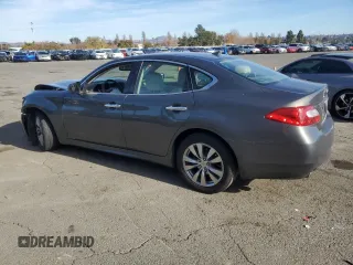 2012 Infiniti M37 with VIN JN1BY1AP8CM333839, listed as a Copart auction lot 84052134 with 121,979 mi miles and Salvage Title. Bid and sale history available at carsss.com. Image 2.