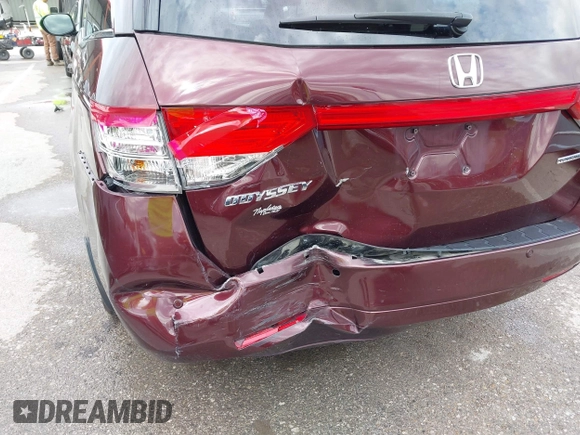 2014 Honda Odyssey Touring with VIN 5FNRL5H9XEB073156, listed as a IAAI auction lot 41990714 with 166,129 mi miles and . Bid and sale history available at DreamBid. Image 17.