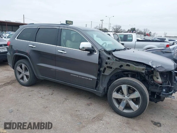 2014 Jeep Grand Cherokee Overland with VIN 1C4RJECG5EC207211, listed as a IAAI auction lot 41586309 with 115,293 mi miles. Bid and sale history available at carsss.com. Image 1.