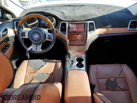 2011 Jeep Grand Cherokee Overland with VIN 1J4RS6GG7BC665979, listed as a Copart auction lot 83394214 with 216,988 mi miles and Salvage Title. Bid and sale history available at DreamBid. Image 8.