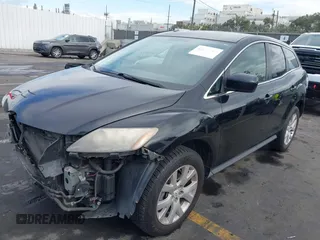 2009 Mazda CX-7 Grand Touring with VIN JM3ER29L990234727, listed as a IAAI auction lot 41272921 with 173,753 mi miles. Bid and sale history available at carsss.com. Image 2.