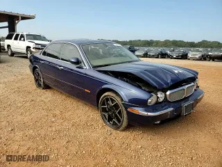 2004 Jaguar XJ with VIN SAJWA71C34SG19800, listed as a Copart auction lot 71877194 with 157,051 mi miles and Salvage Title. Bid and sale history available at carsss.com. Image 11.