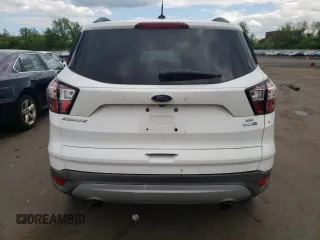 2018 Ford Escape SE z VIN 1FMCU9GDXJUA71940, wystawiony jako Copart lot #55891775 z przebiegiem 117 298 mil mil oraz Tytuł czysty. Historia ofert i sprzedaży dostępna na DreamBid. Obrazek 6.