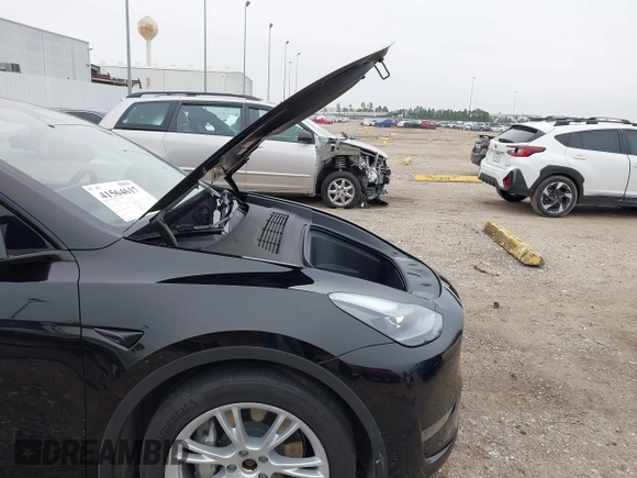 2023 Tesla Model Y Long Range z VIN 7SAYGDEEXPA181114, wystawiony jako IAAI lot #41564617 z przebiegiem 64 990 mil mil oraz . Historia ofert i sprzedaży dostępna na DreamBid. Obrazek 10.