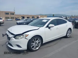 2016 Mazda Mazda6 i Touring with VIN JM1GJ1V57G1429887, listed as a IAAI auction lot 42029170 with 140,519 mi miles. Bid and sale history available at carsss.com. Image 17.