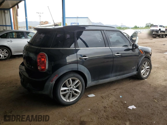 2014 MINI Countryman S with VIN WMWZC5C56EWP38065, listed as a Copart auction lot 59518395 with 91,106 mi miles and Salvage title. Bid and sale history available at DreamBid. Image 3.